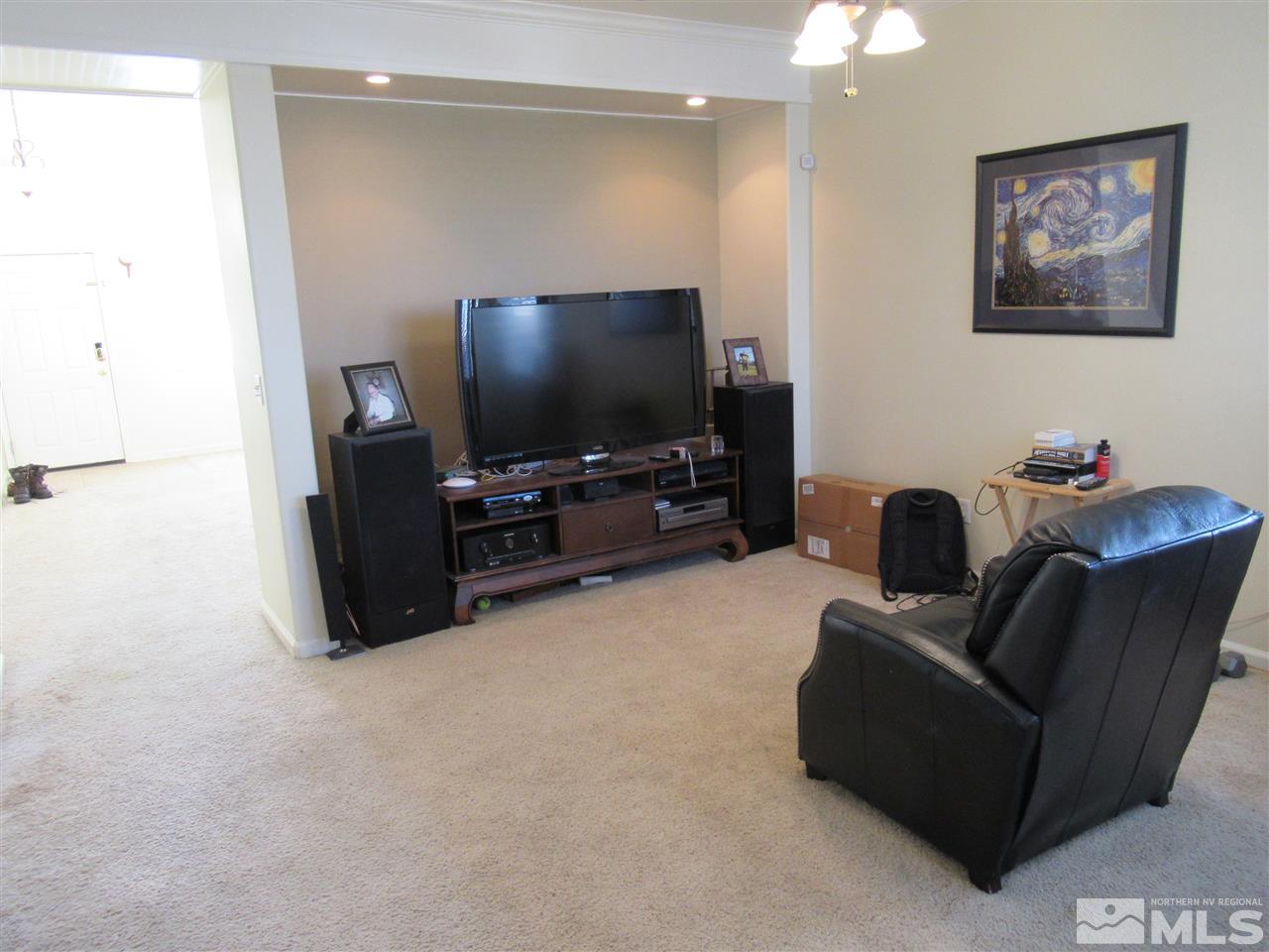 2347 Clementine Lane Reno, NV 89521 - Photo 12 of 19 a living room with furniture and a flat screen tv