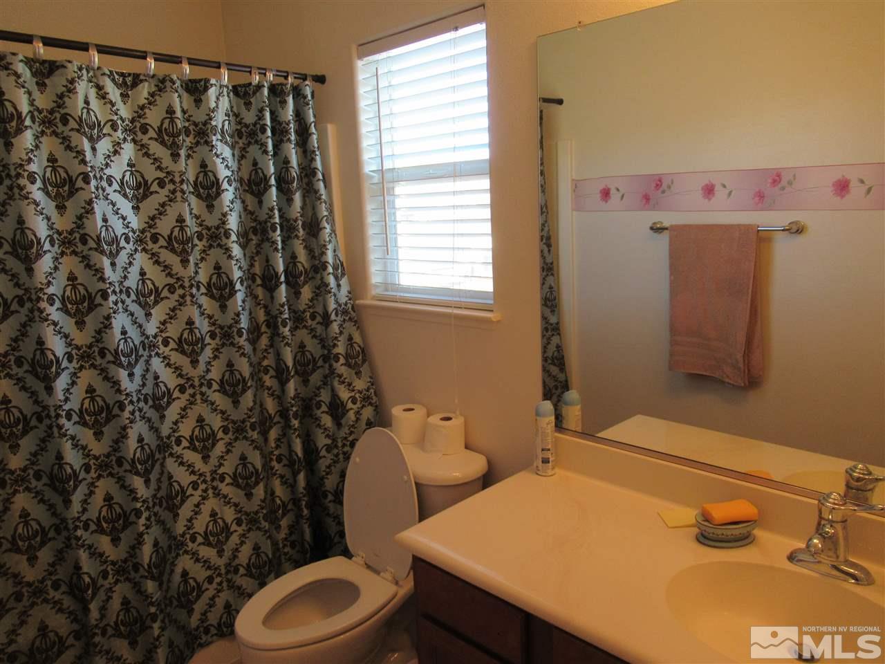 2347 Clementine Lane Reno, NV 89521 - Photo 16 of 19 a bathroom with a sink toilet and shower