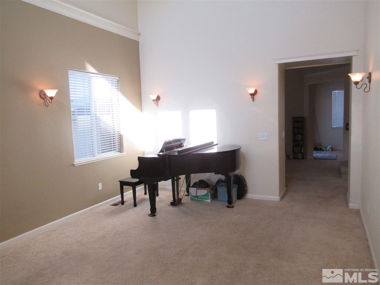 2347 Clementine Lane Reno, NV 89521 - Photo 2 of 19 a view of a workspace with furniture and a window