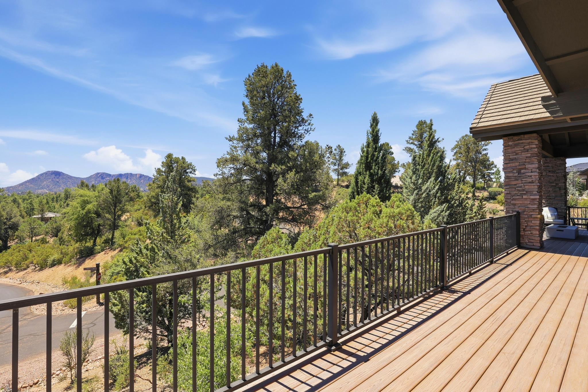 2908 East Rim Club Drive Payson, AZ 85541 - Photo 51 of 77 a view of a balcony with wooden floor and fence