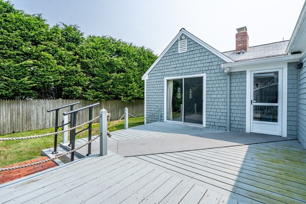 22 Beach View Road Dennis, MA 02670 - Photo 11 of 42 a view of a house with backyard and sitting area
