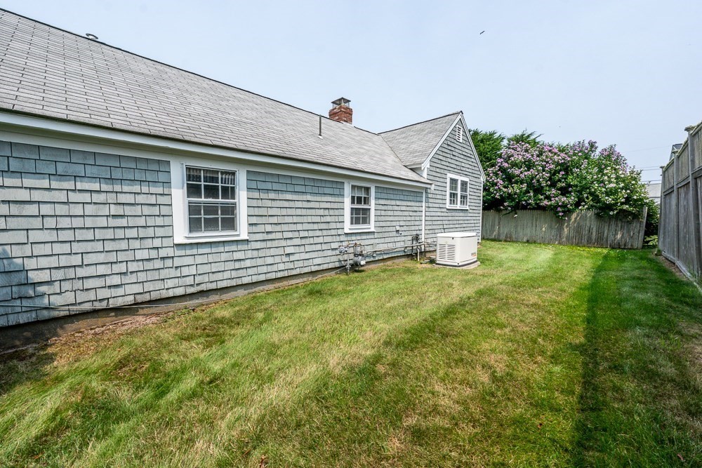 22 Beach View Road Dennis, MA 02670 - Photo 12 of 42 a view of a house with a yard and plants