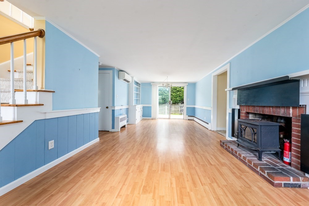 22 Beach View Road Dennis, MA 02670 - Photo 13 of 42 a view of a livingroom with a fireplace and a window