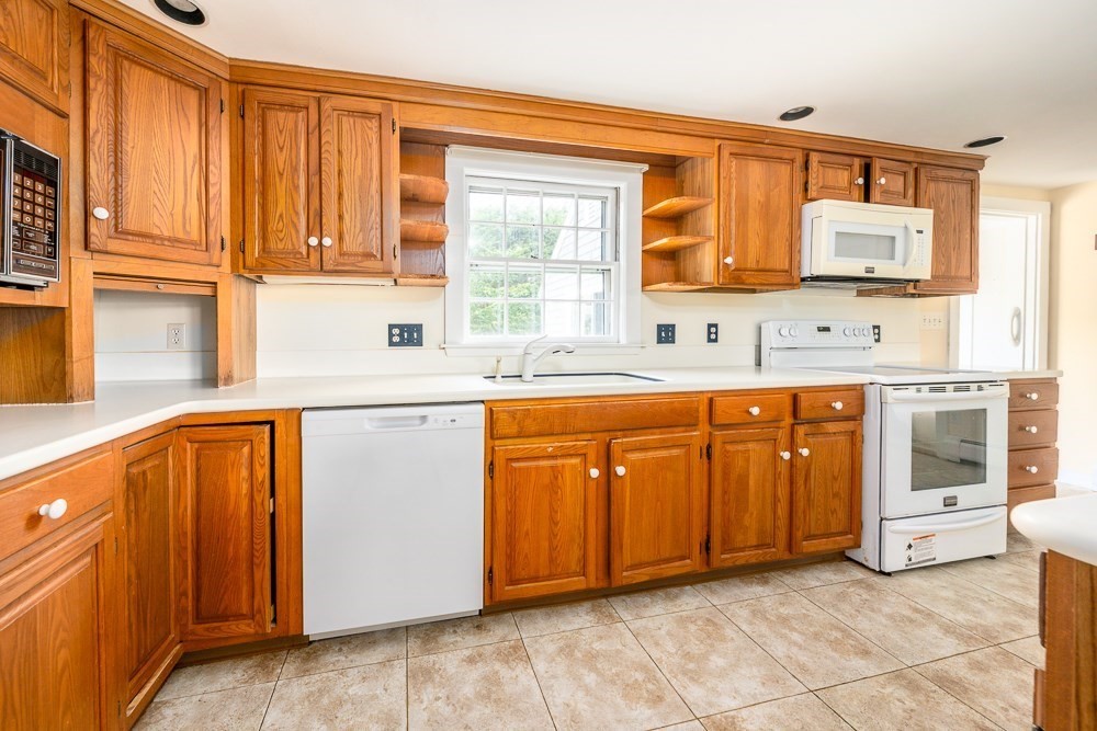 22 Beach View Road Dennis, MA 02670 - Photo 18 of 42 a kitchen with stainless steel appliances granite countertop a sink and cabinets