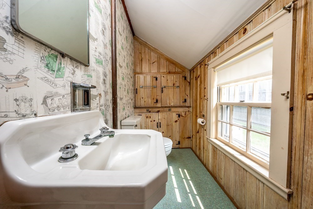 22 Beach View Road Dennis, MA 02670 - Photo 22 of 42 a bathroom with a sink and a large mirror