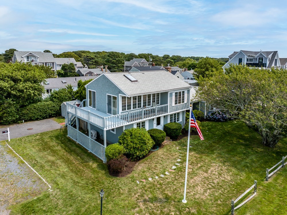 22 Beach View Road Dennis, MA 02670 - Photo 3 of 42 a aerial view of a house with a yard