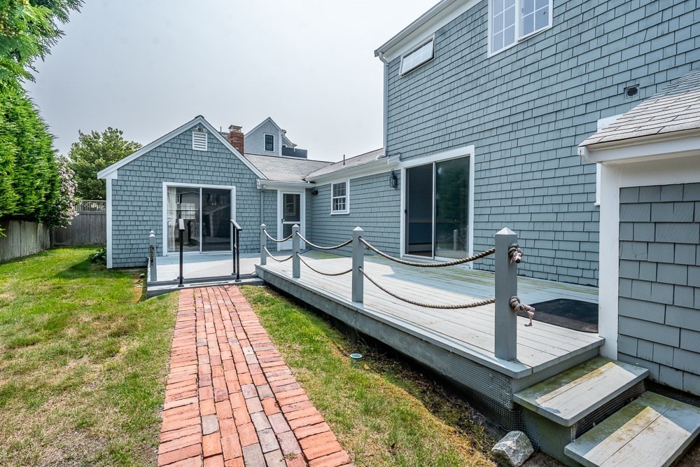 22 Beach View Road Dennis, MA 02670 - Photo 9 of 42 a view of a house with backyard and porch