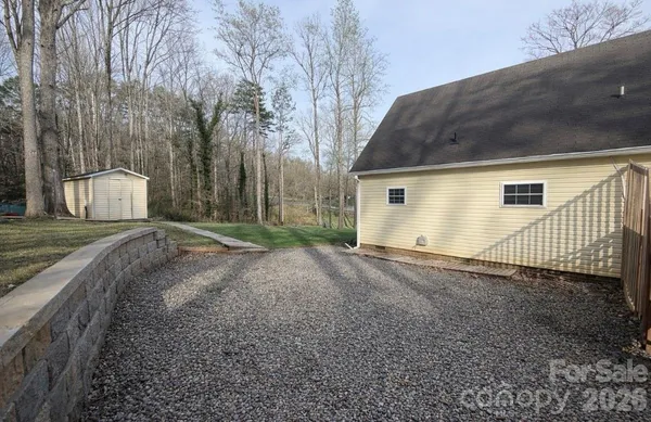 a view of a backyard of the house