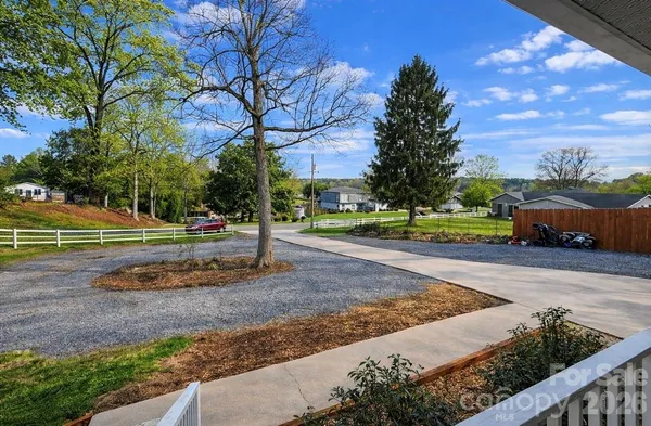a view of a park with large trees