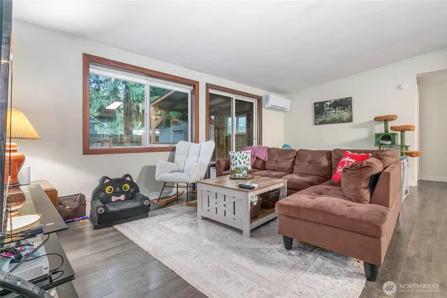a living room with furniture and a window