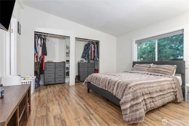 a bedroom with a bed and a dresser