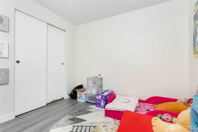 a bedroom with a bed and a dresser