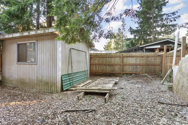 a backyard of a house with lots of trees
