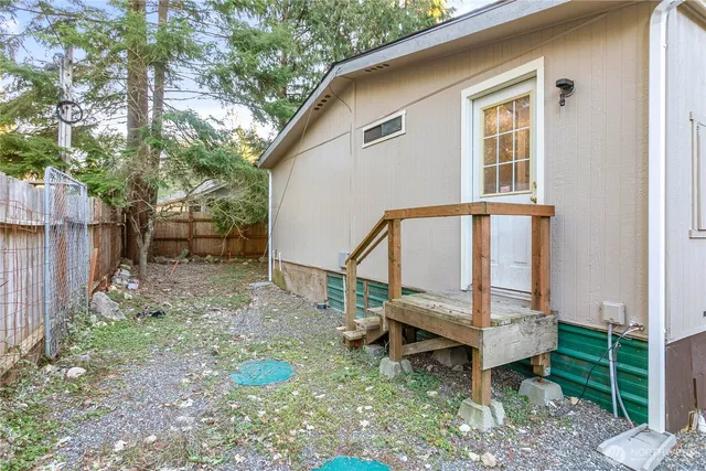 a backyard of a house with seating space