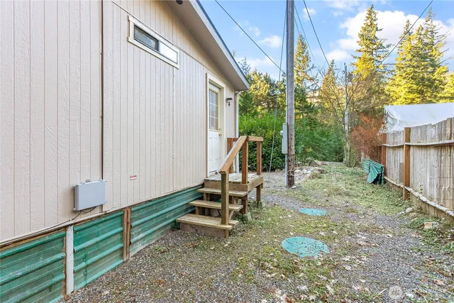 a view of a backyard with chairs