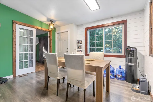 a view of a dining room with furniture window and outside view