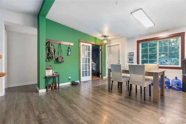 a view of a dining room with furniture window and wooden floor