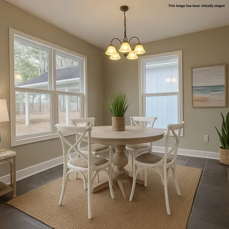 a dining room with furniture and window