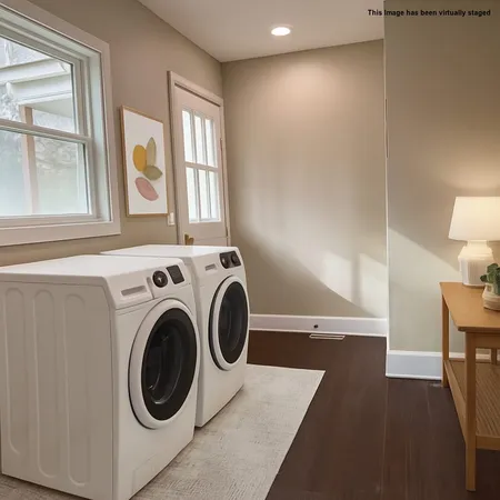 a view of a hallway with washer and dryer