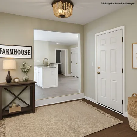 a view of a room with wooden floor and cabinet