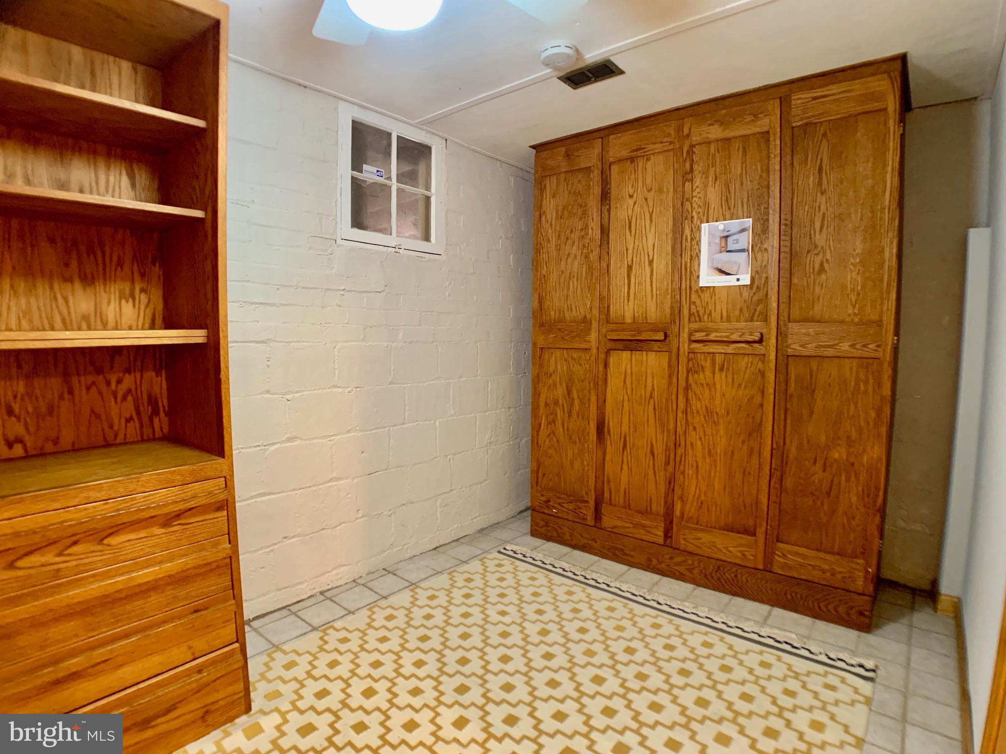 4545 South Chelsea Lane Bethesda, MD 20814 - Photo 20 of 32 Lower level guest room with Murphy bed