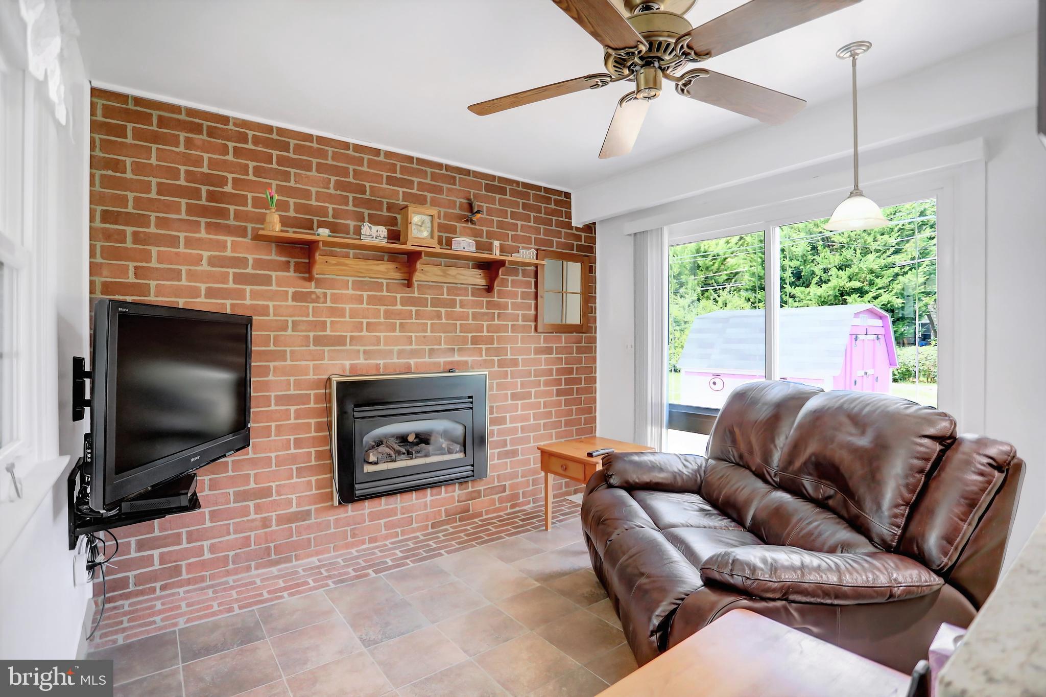 226 Northway Road Reisterstown, MD 21136 - Photo 31 of 47 family room w heated porcelain floors & fireplace