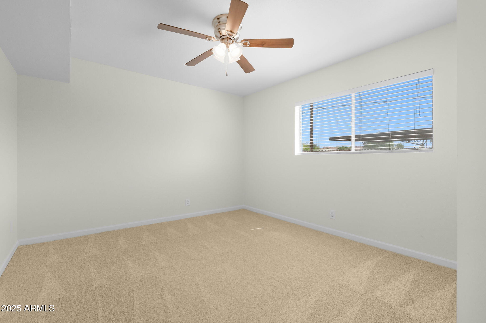 749 East Montebello Avenue, Unit 127 Phoenix, AZ 85014 - Photo 12 of 20 an empty room with a window