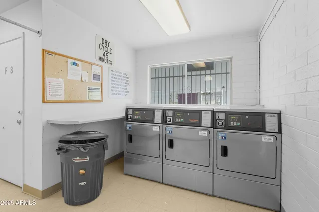 a kitchen with stainless steel appliances granite countertop a stove and a refrigerator