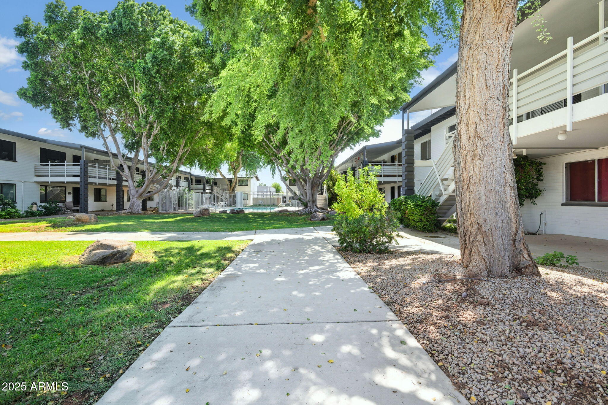 749 East Montebello Avenue, Unit 127 Phoenix, AZ 85014 - Photo 19 of 20 a view of a house with a swimming pool