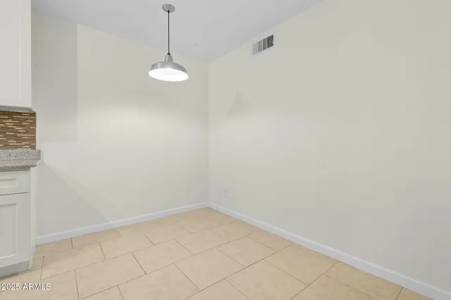 a view of a room with a fan