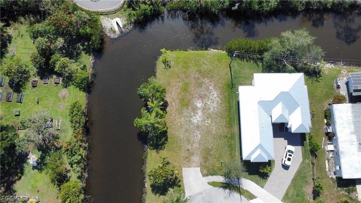 3260 Lunar Street Naples, FL 34112 - Photo 3 of 5 an aerial view of a house with outdoor space and lake view
