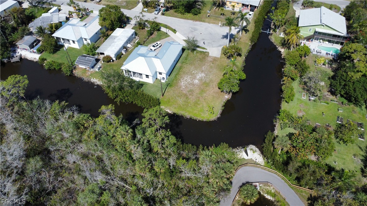 3260 Lunar Street Naples, FL 34112 - Photo 4 of 5 an aerial view of residential house with outdoor space and trees all around
