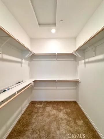 a spacious bathroom with a granite countertop sink a mirror and a bathtub