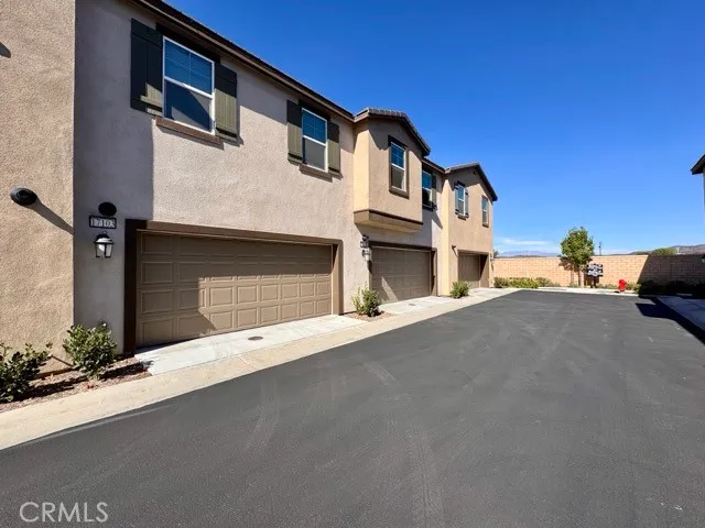 a front view of a house with garage