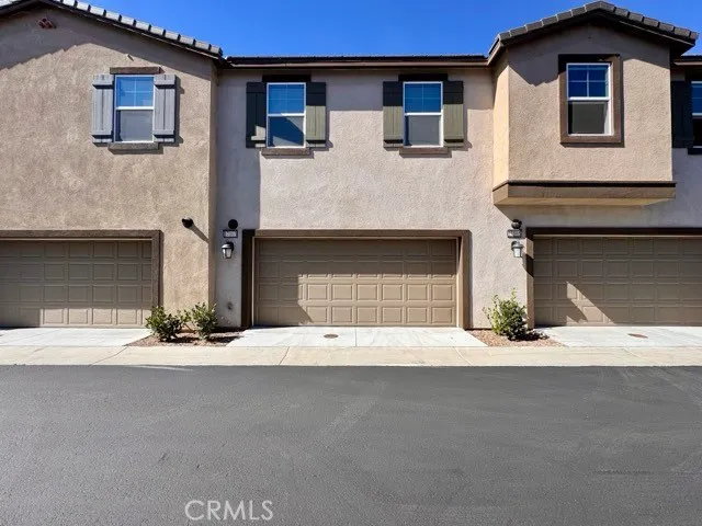 a front view of a house with garage