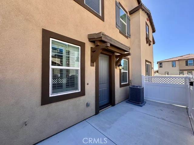 a view of a house with a barbeque