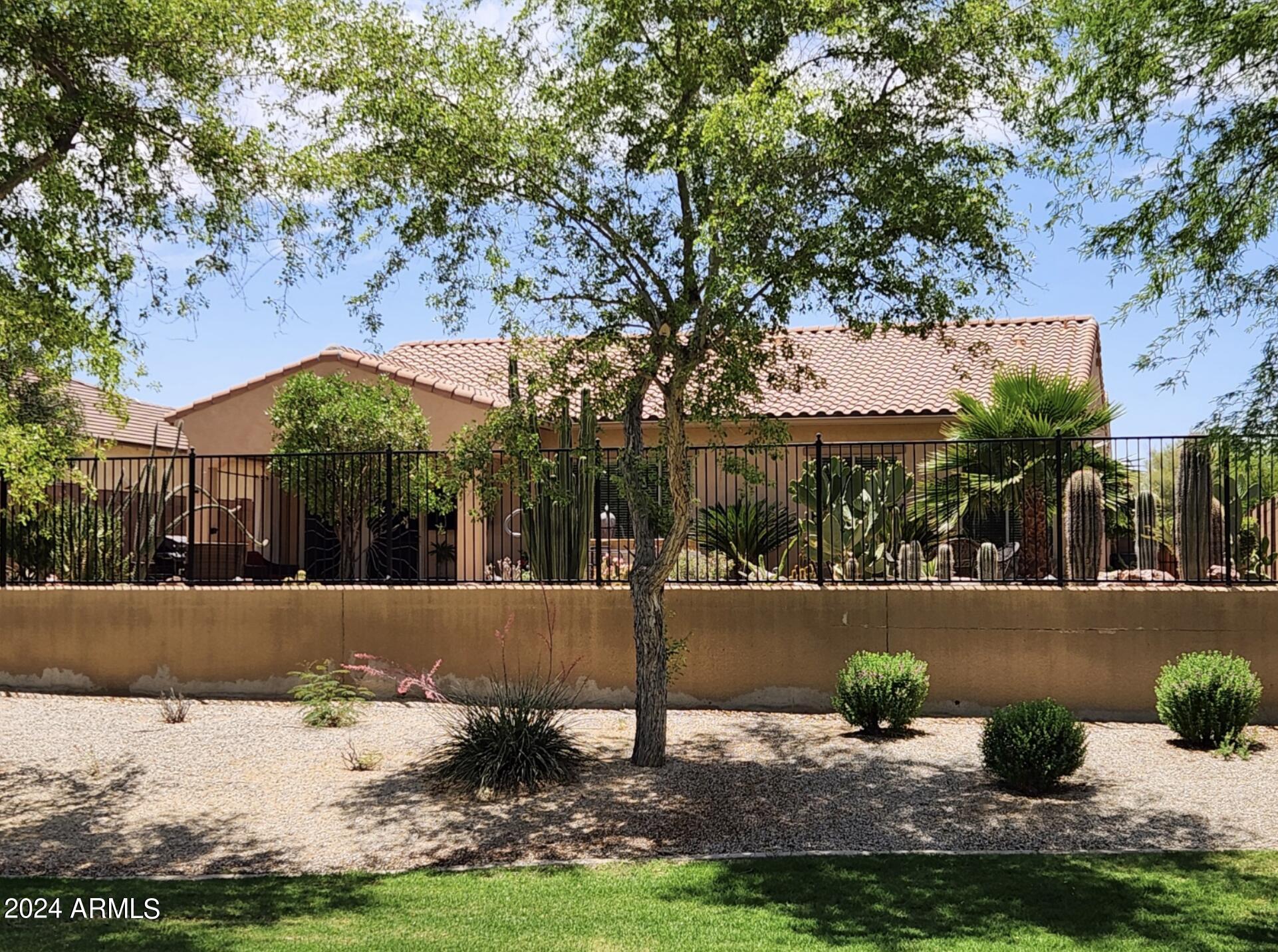 17858 West Verdin Road Goodyear, AZ 85338 - Photo 2 of 78 a front view of a house with garden