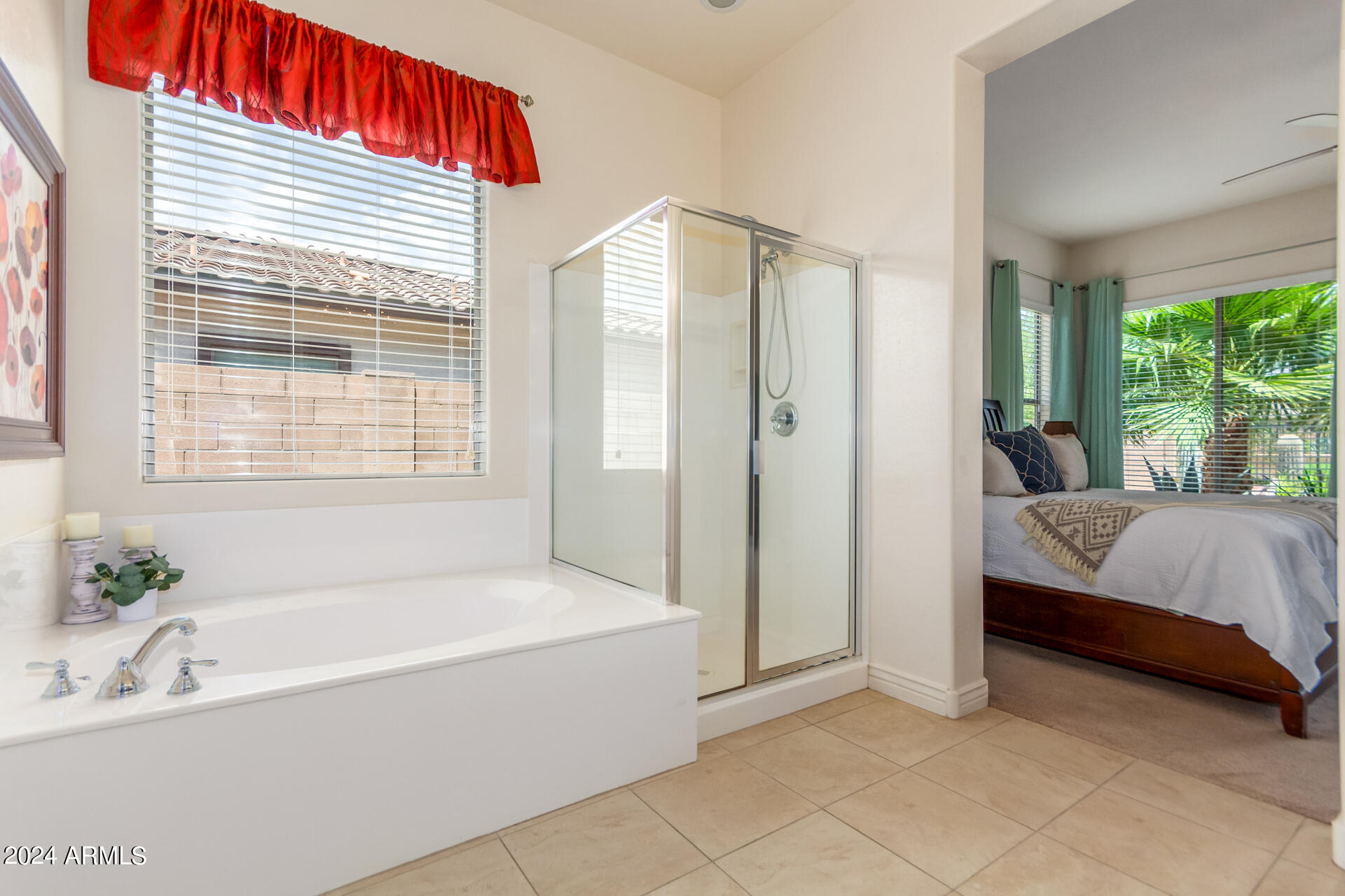 17858 West Verdin Road Goodyear, AZ 85338 - Photo 22 of 78 a spacious bathroom with a bathtub and a shower