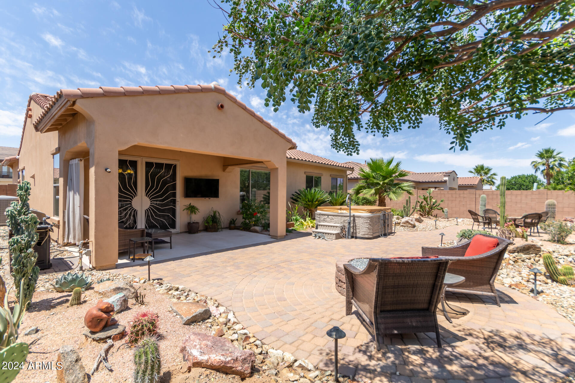 17858 West Verdin Road Goodyear, AZ 85338 - Photo 36 of 78 a view of a house with backyard sitting area and porch