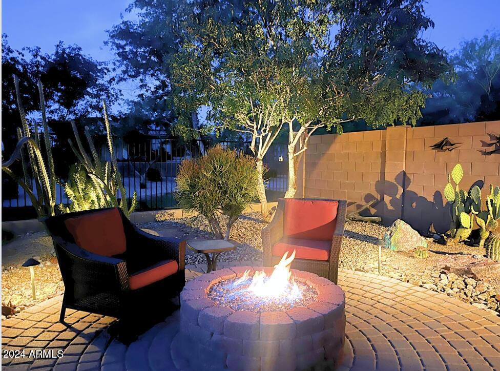 17858 West Verdin Road Goodyear, AZ 85338 - Photo 39 of 78 a view of outdoor sitting area with furniture and wooden fence