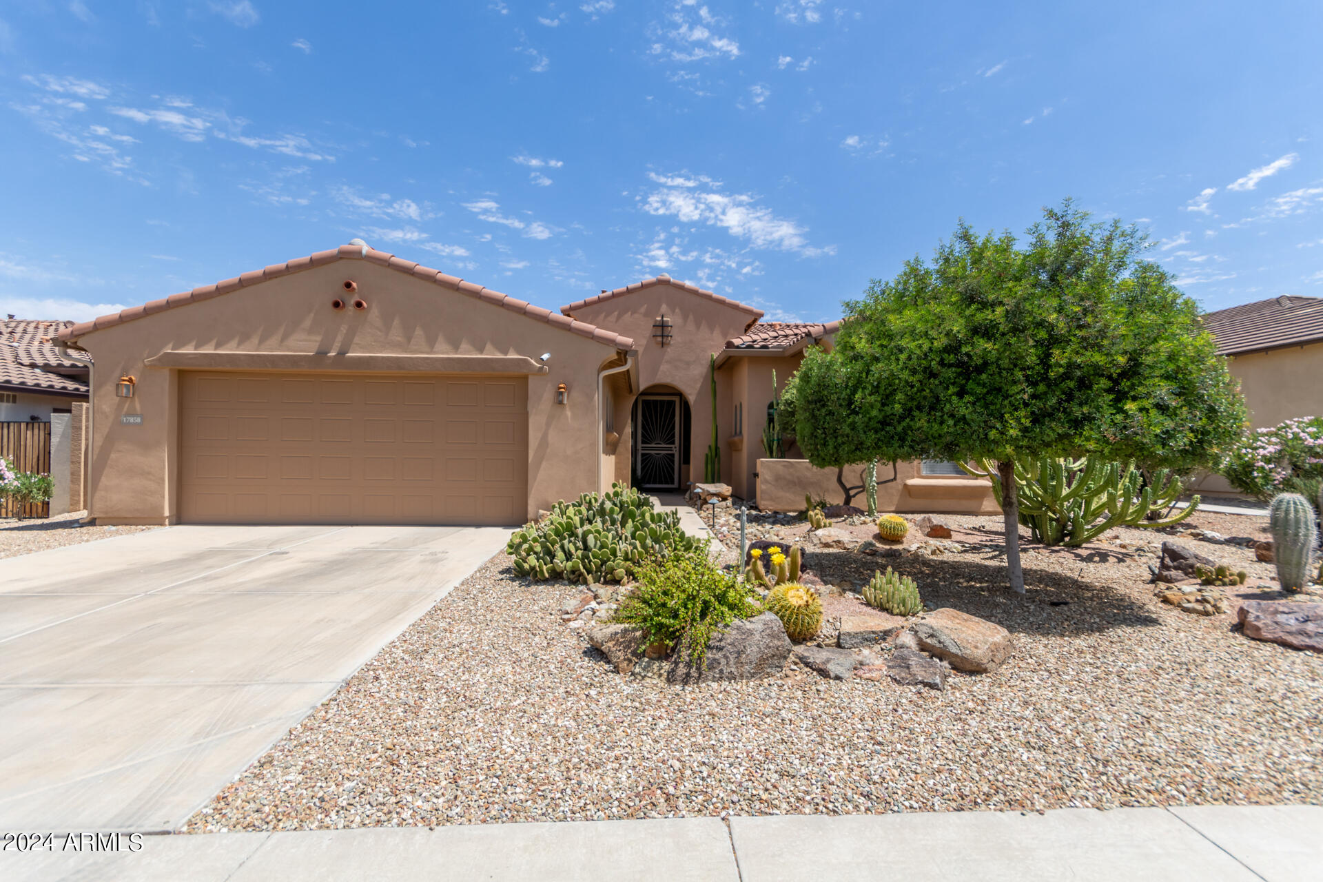 17858 West Verdin Road Goodyear, AZ 85338 - Photo 4 of 78 a front view of a house with garden