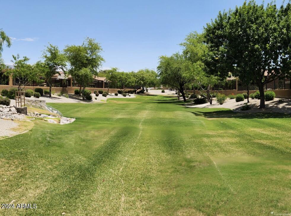 17858 West Verdin Road Goodyear, AZ 85338 - Photo 45 of 78 a view of yard with swimming pool and green space