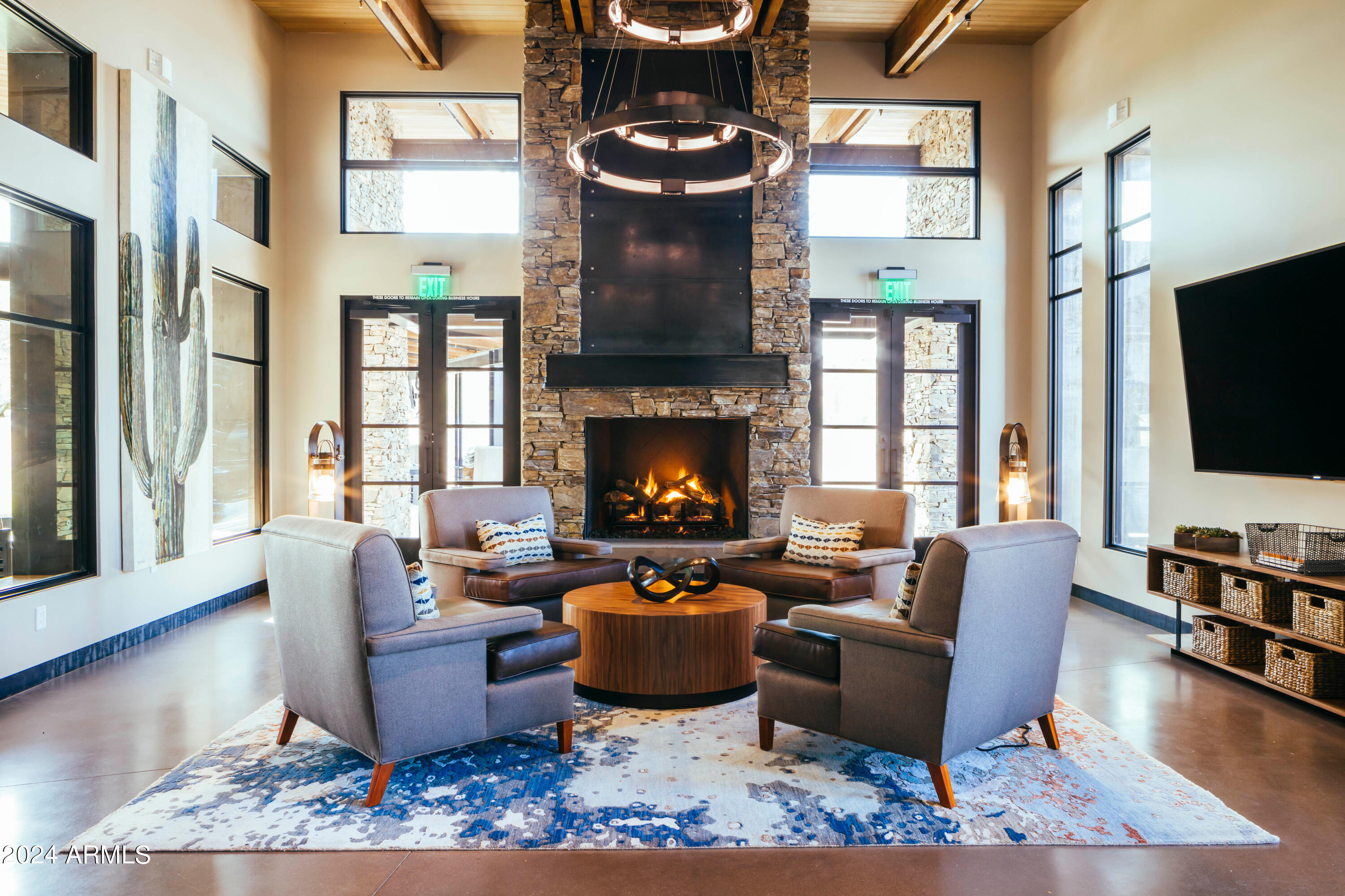 17858 West Verdin Road Goodyear, AZ 85338 - Photo 52 of 78 a living room with furniture fireplace and flat screen tv