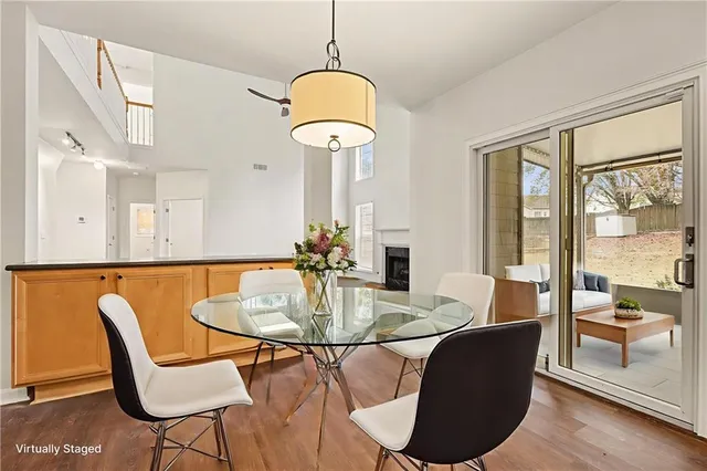 a view of a dining room with furniture window and wooden floor