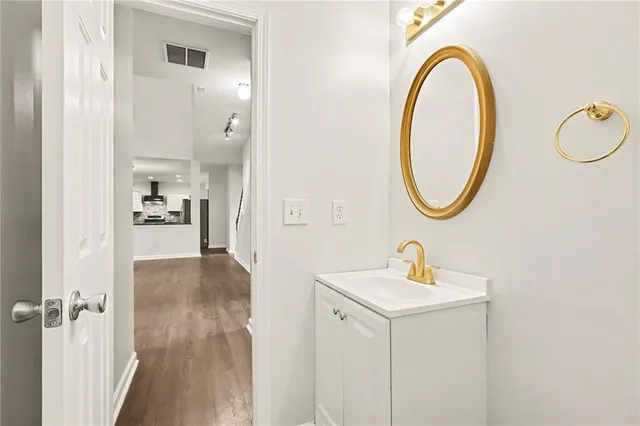 a bathroom with a sink a mirror and a window