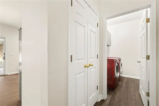 a view of hallway with wooden floor