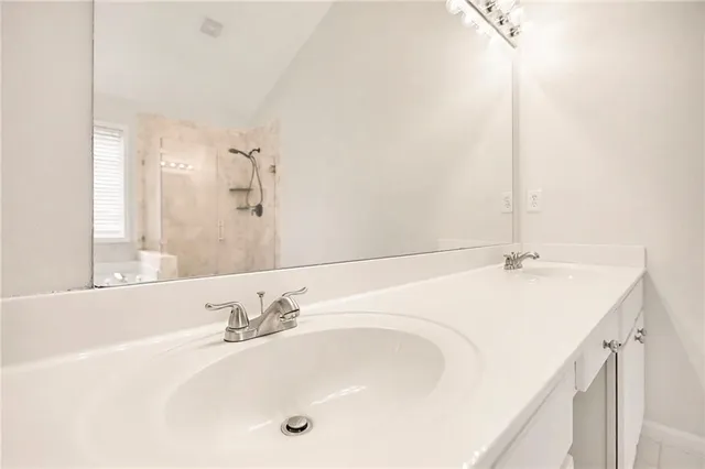 a bathroom with a bathtub and a sink