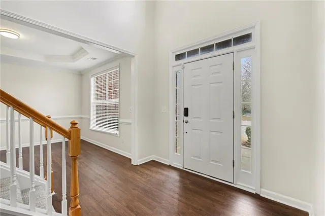 a view of an entryway with wooden floor