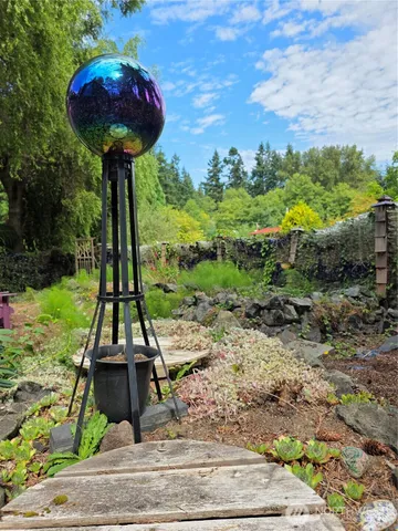 a wooden bench sitting in front of a building