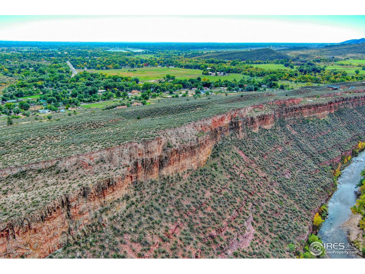 3501 Raptor Ridge Lane Laporte, CO 80535 - Photo 8 of 22 a view of a big yard with floor to ceiling windows